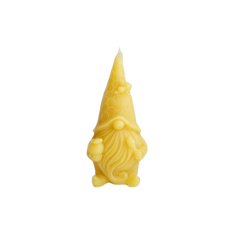 Beeswax candle shaped like a gnome.